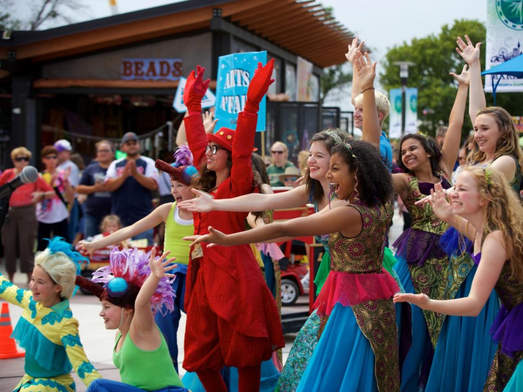 Arts A'Fair performers smiling and bowing