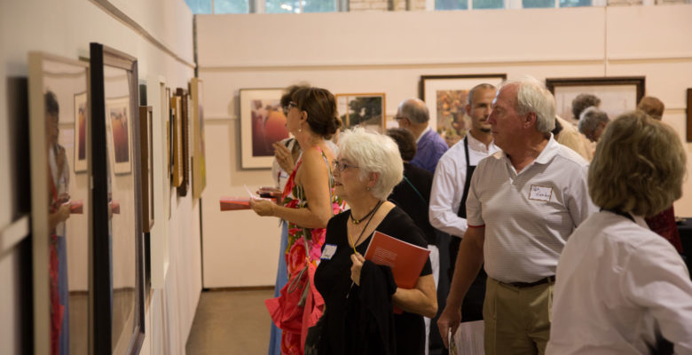 First Glance guests looking at fine art