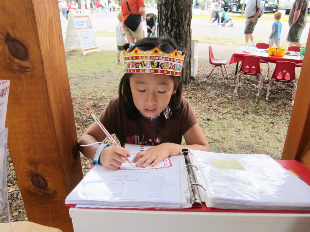 Little Girl wearing Alphabet Forest crown